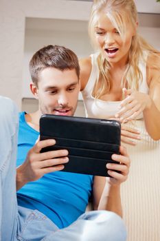 bright picture of happy couple with tablet PC