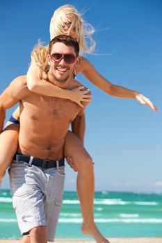 picture of happy couple in sunglasses on the beach.