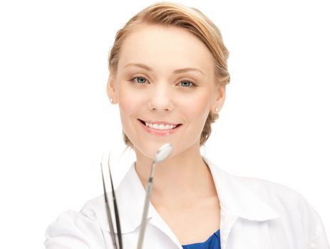 picture of attractive female dentist with tools....