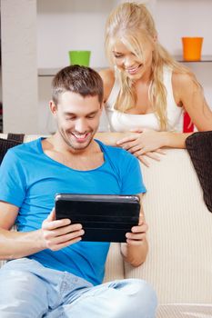 bright picture of happy couple with tablet PC