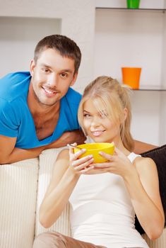 bright picture of happy couple with muesli (focus on man)