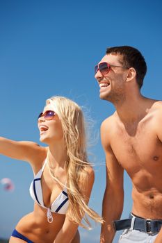 picture of happy couple in sunglasses on the beach.