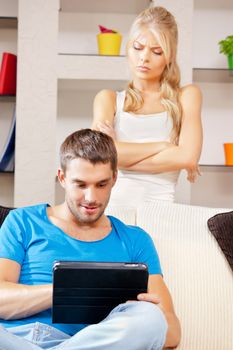 bright picture of couple with tablet PC (focus on man)