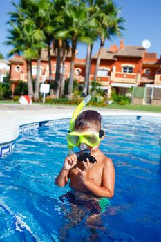 Activities on the pool. Cute boy in swimming pool