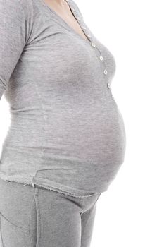 Closeup of pregnant woman at white background