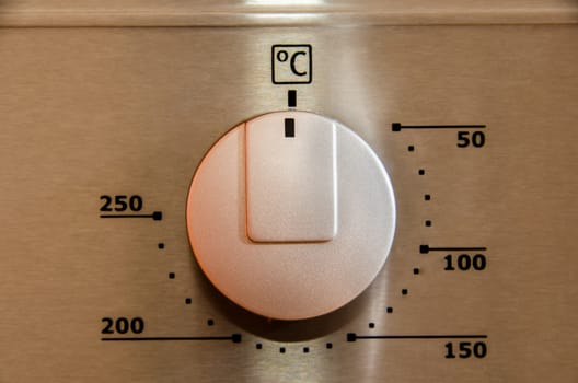 Silver on off button on the cooker and oven.