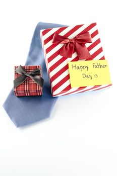 neck tie and two gift boxes with card tag write happy father day word on a white background