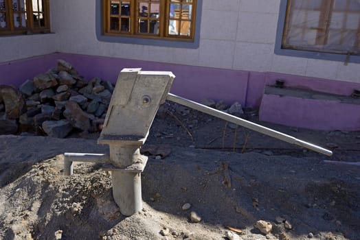 Hand water pump (retro style) in Leh, India