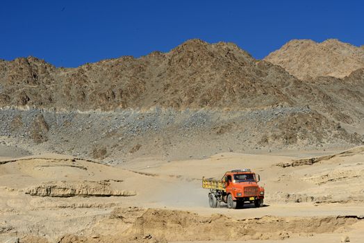Colorful truck on the mountain road between Manali and Leh in Ladakh, India