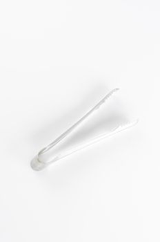 ice tongs on a white background
