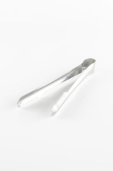 ice tongs on a white background