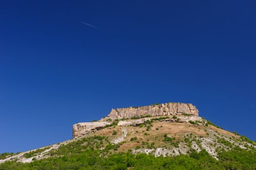 Tepe Kermen and aircraft in the sky, Crimea, Ukraine or Russia