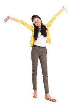 Portrait of an Asian girl open hands wide and smiling happy, full body standing isolated on white background.