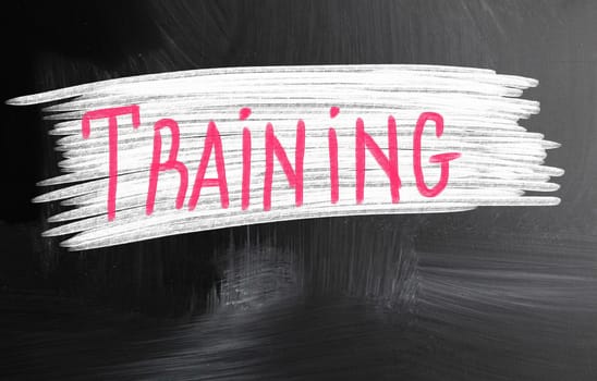 training handwritten with chalk on a blackboard