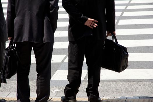 Business man waiting to cross the street,Tokyo Japan