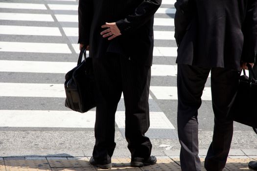Business man waiting to cross the street,Tokyo Japan