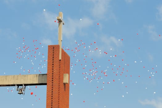 Red and white ballons released at a church in Bloemfontein, South Africa
