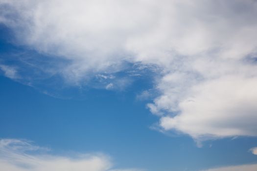 White easy clouds in the blue sky