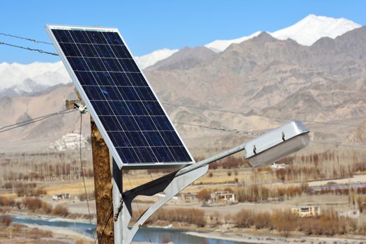 solarcells on a winter roof with snow mountain