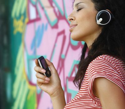 happy young woman in headphones listen to music