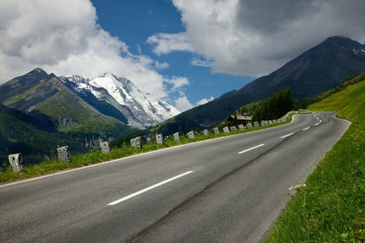 Alpine road between high mountains