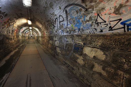 Dirty pedestrian tunnel at night