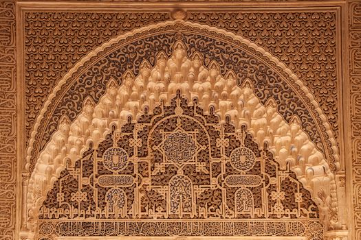 Ancient arabian ornament on a wall in Alhambra palace, Granada, Andalucia, Spain
