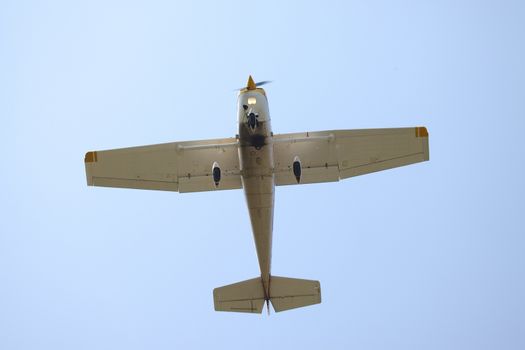 Small plane against clear blue, sky