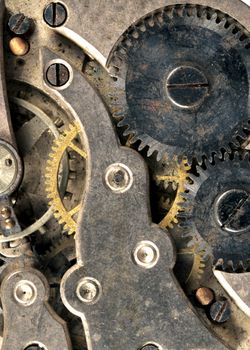 Extreme close up of the inside workings of a jeweled pocket watch time piece