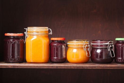 Jars of jam on a shelf