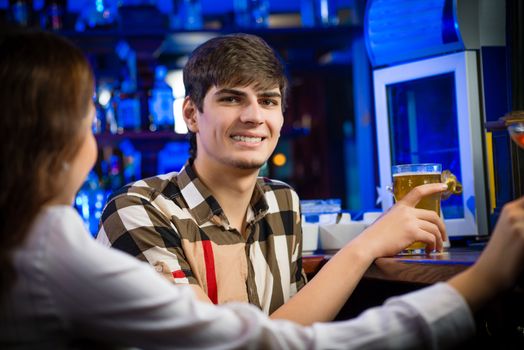 portrait of a young man at the bar, fun nightlife