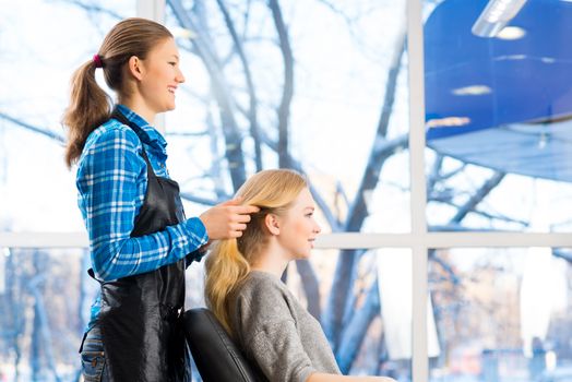 young attractive woman hairdresser hairstyle customer picks