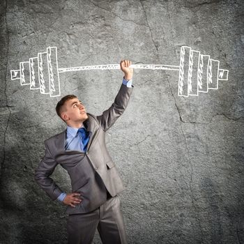 businessman holding a hand sketched barbell, concept achievements in business