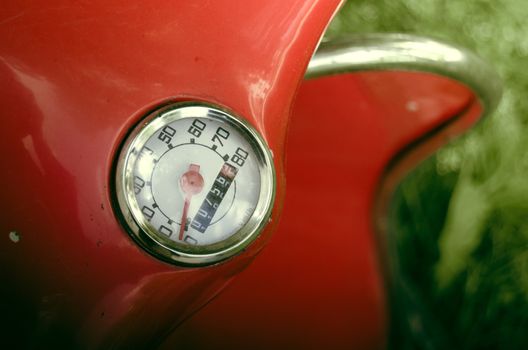 Detail Of A Speedometer On A Red Retro Vintage Moped Or Scooter