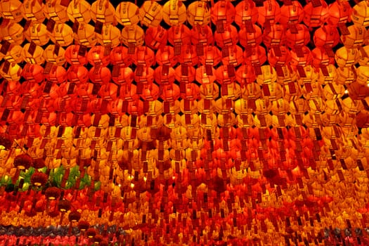 Many red, yellow and green glowing lanterns on Buddha's birthday, perspective view