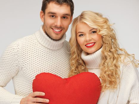 picture of family couple in a sweaters with heart