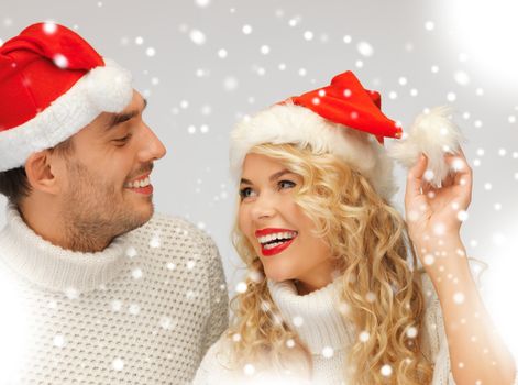 picture of family couple in sweaters and santa's hats