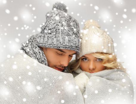 bright picture of family couple under warm blanket