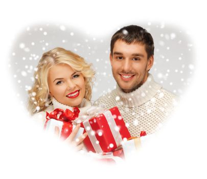 picture of family couple in a sweaters with gift boxes