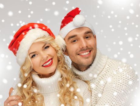 picture of family couple in sweaters and santa's hats