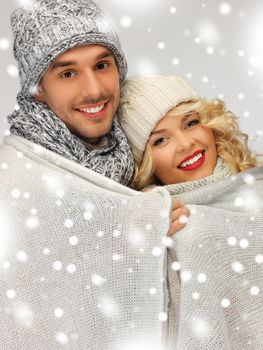 bright picture of family couple under warm blanket