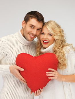 picture of family couple in a sweaters with heart