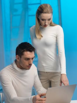 picture of man and woman in space laboratory