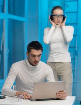 picture of man and woman in space laboratory