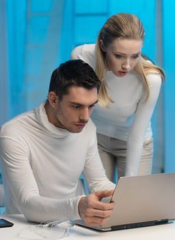 picture of man and woman in space laboratory