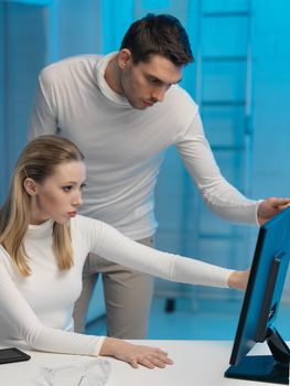 picture of man and woman in space laboratory