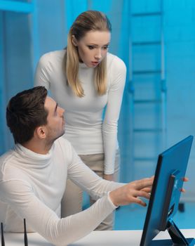 picture of man and woman in space laboratory