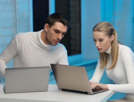 picture of man and woman in space laboratory