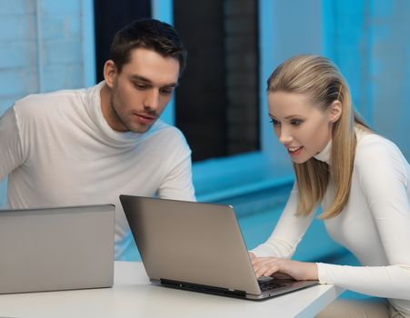 picture of man and woman in space laboratory