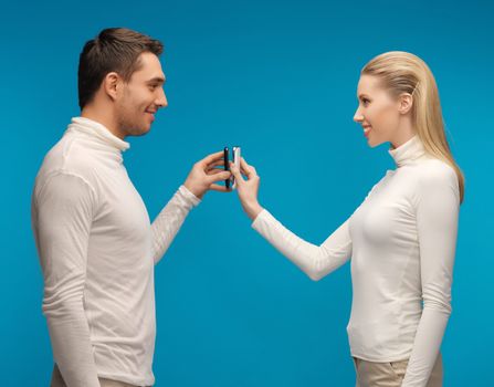 picture of man and woman with modern gadgets